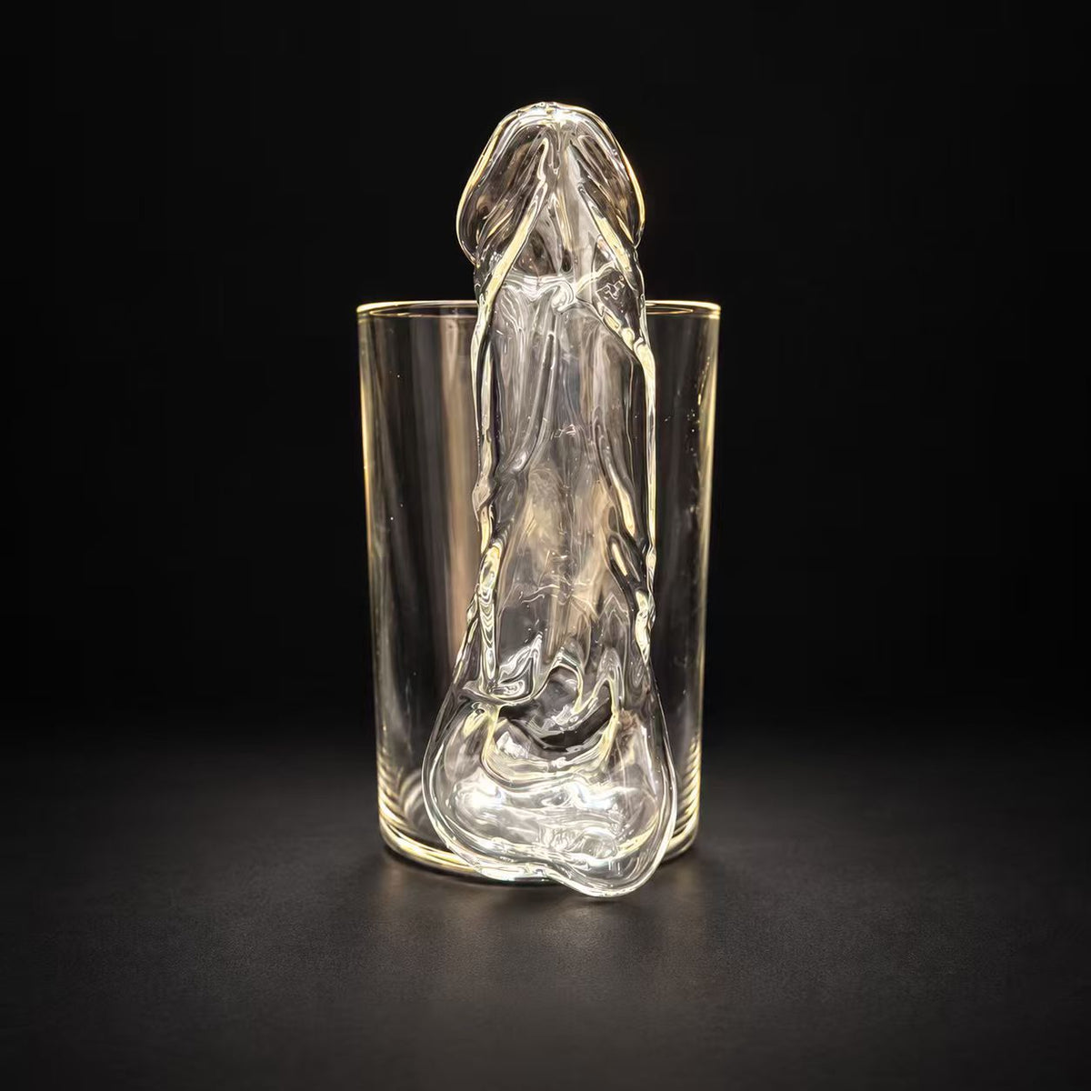 Hollow sculpted handle detail on handmade glass mug